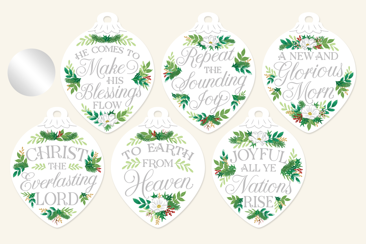 Silver floral Christmas ornaments with hand-lettered carol lyrics