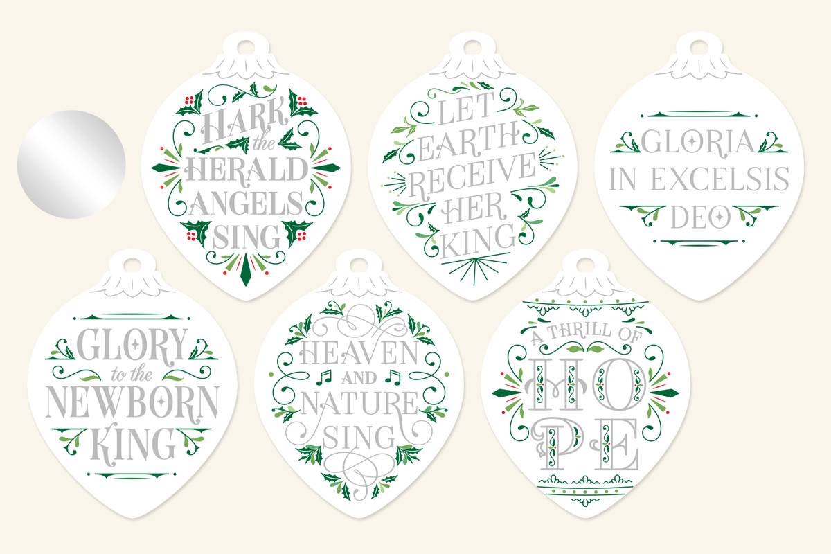 Silver festive Christmas ornaments with hand-lettered carol lyrics