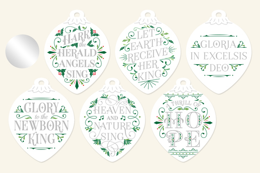 Silver festive Christmas ornaments with hand-lettered carol lyrics