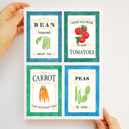 Four framed prints with vegetable-themed sayings held by a person against a white background